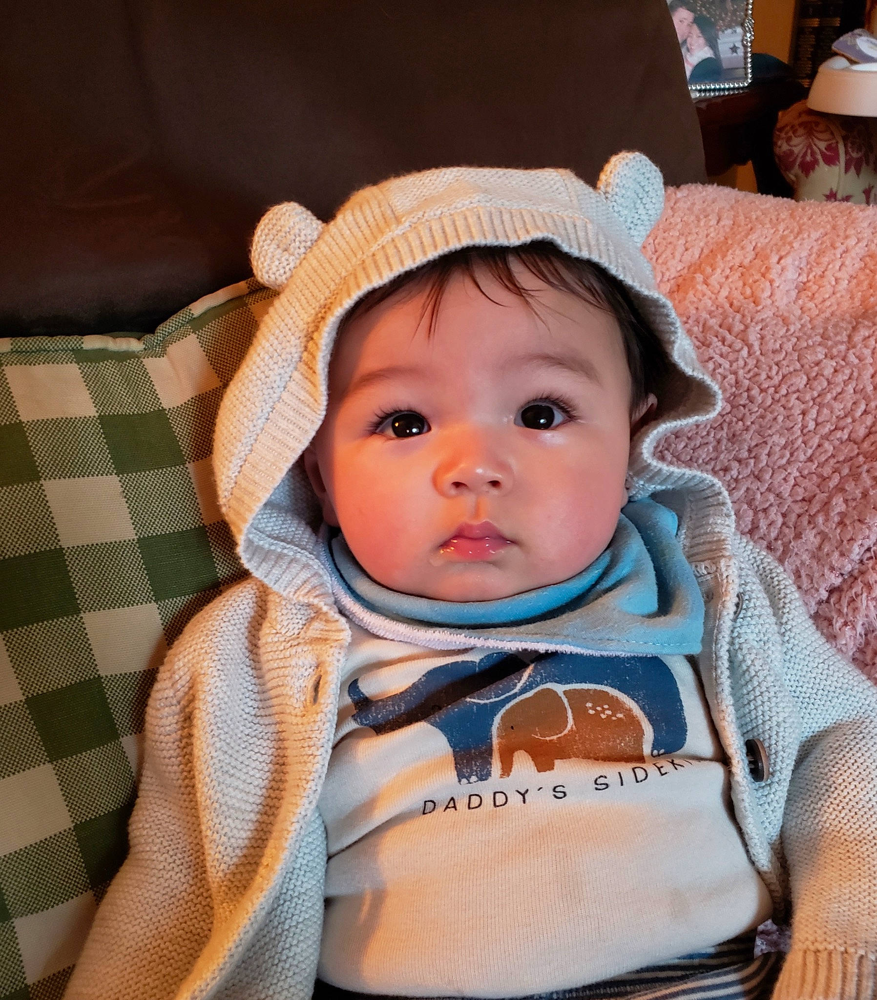 Harrison is registered to the contest to win money with this photo: baby, baby_carriage, baby_products, baby_safety, baby_toddler_clothing, cheek, child, comfort, eye, eyebrow, eyelash, fashion_accessory, happy, headwear, iris, pattern, person, sitting, skin, sleeve