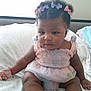 Nanyamka is registered to the contest to win money with this photo: baby, child, infant, cute, curly_hair, pink_dress, bows, sitting, bed, blanket, indoors, skin, foot, hand, face, adorable, toddler, soft_lighting, portrait, young