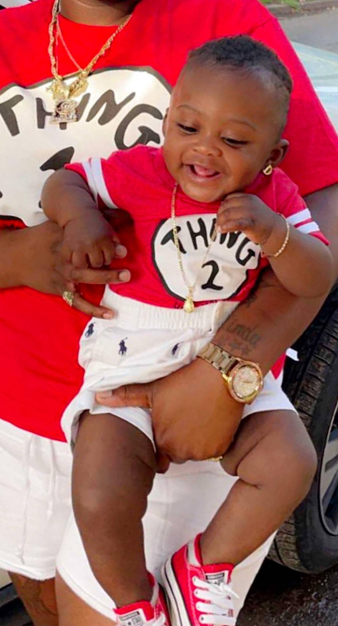 Dakari is registered to the contest to win money with this photo: baby_toddler_clothing, eye, facial_expression, finger, hairstyle, happy, joy, knee, leg, muscle, people, person, pink, red, shorts, skin, smile, t_shirt, thigh, tire