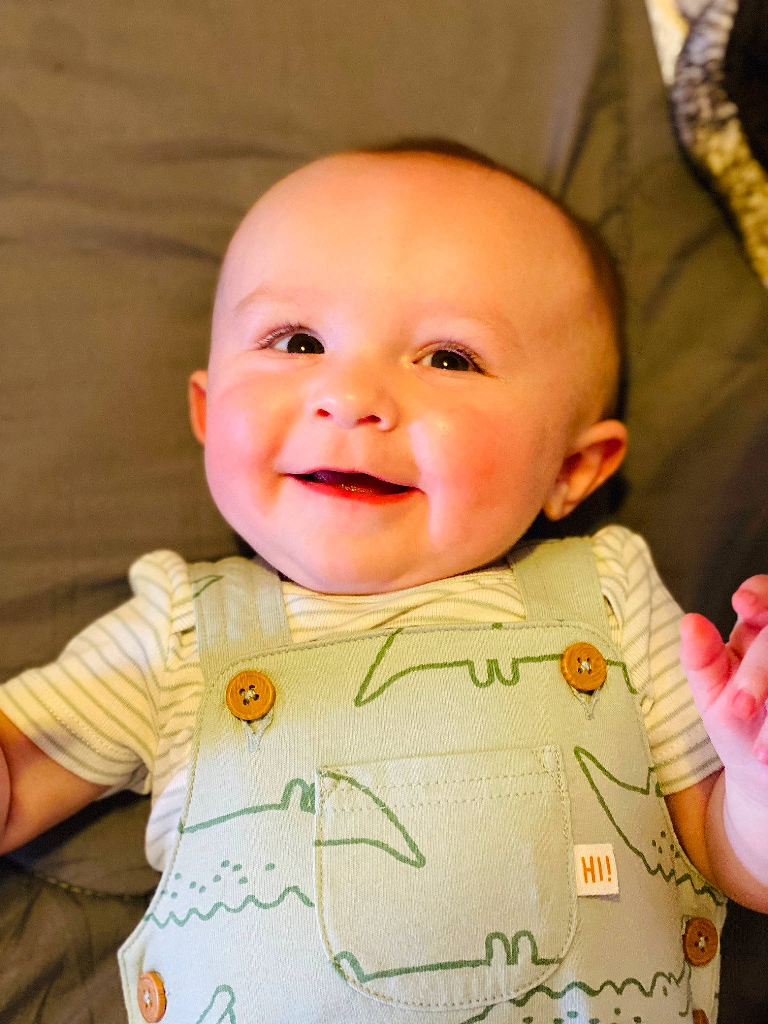 Landen is registered to the contest to win money with this photo: baby, baby_toddler_clothing, cheek, chin, eye, eyebrow, face, facial_expression, finger, gesture, happy, head, iris, joy, lip, mouth, nose, person, pink, skin