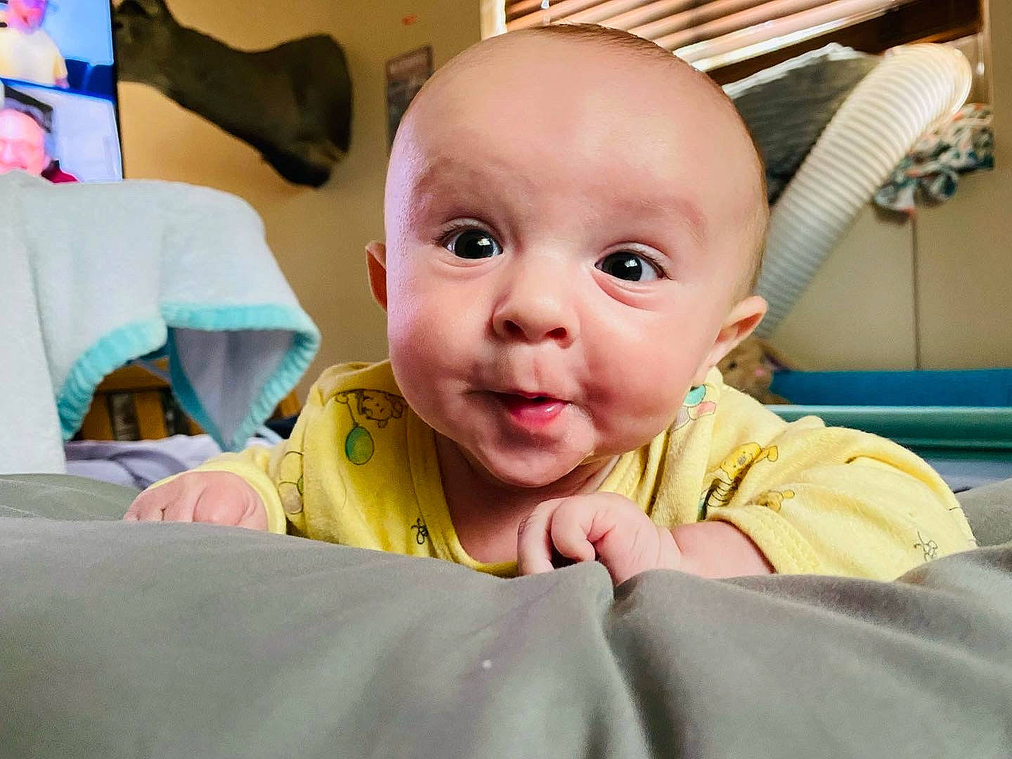 Landen is registered to the contest to win money with this photo: baby, baby_products, baby_safety, baby_toddler_clothing, cheek, child, comfort, ear, eye, eyebrow, eyelash, fun, gesture, happy, person, room, sitting, skin, smile, thumb