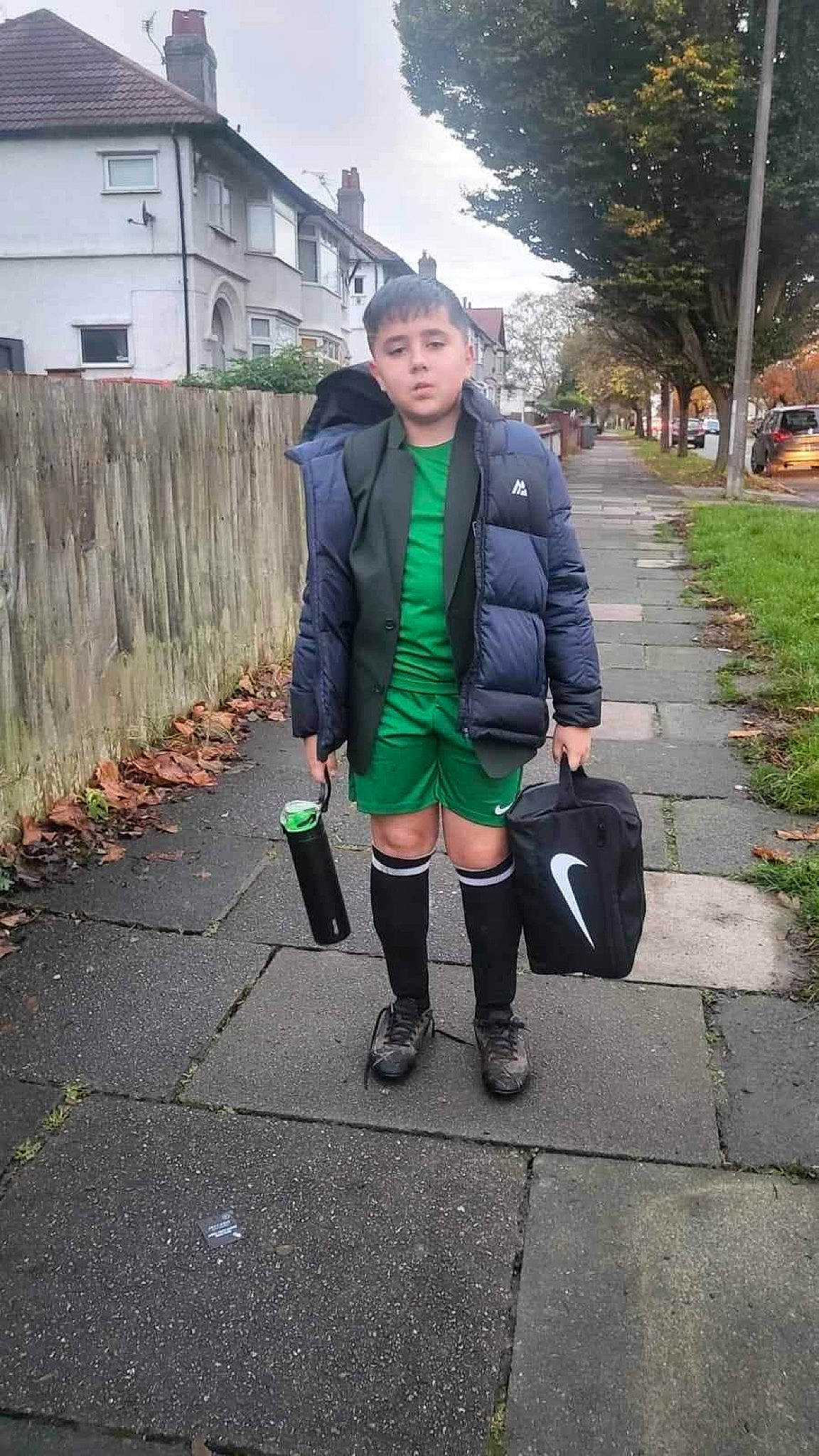 David is registered to the contest to win money with this photo: asphalt, bag, blazer, boot, electric_blue, handbag, knee, leg, leisure, luggage_and_bags, person, plaid, plant, recreation, road, road_surface, shoe, sleeve, tie, tree