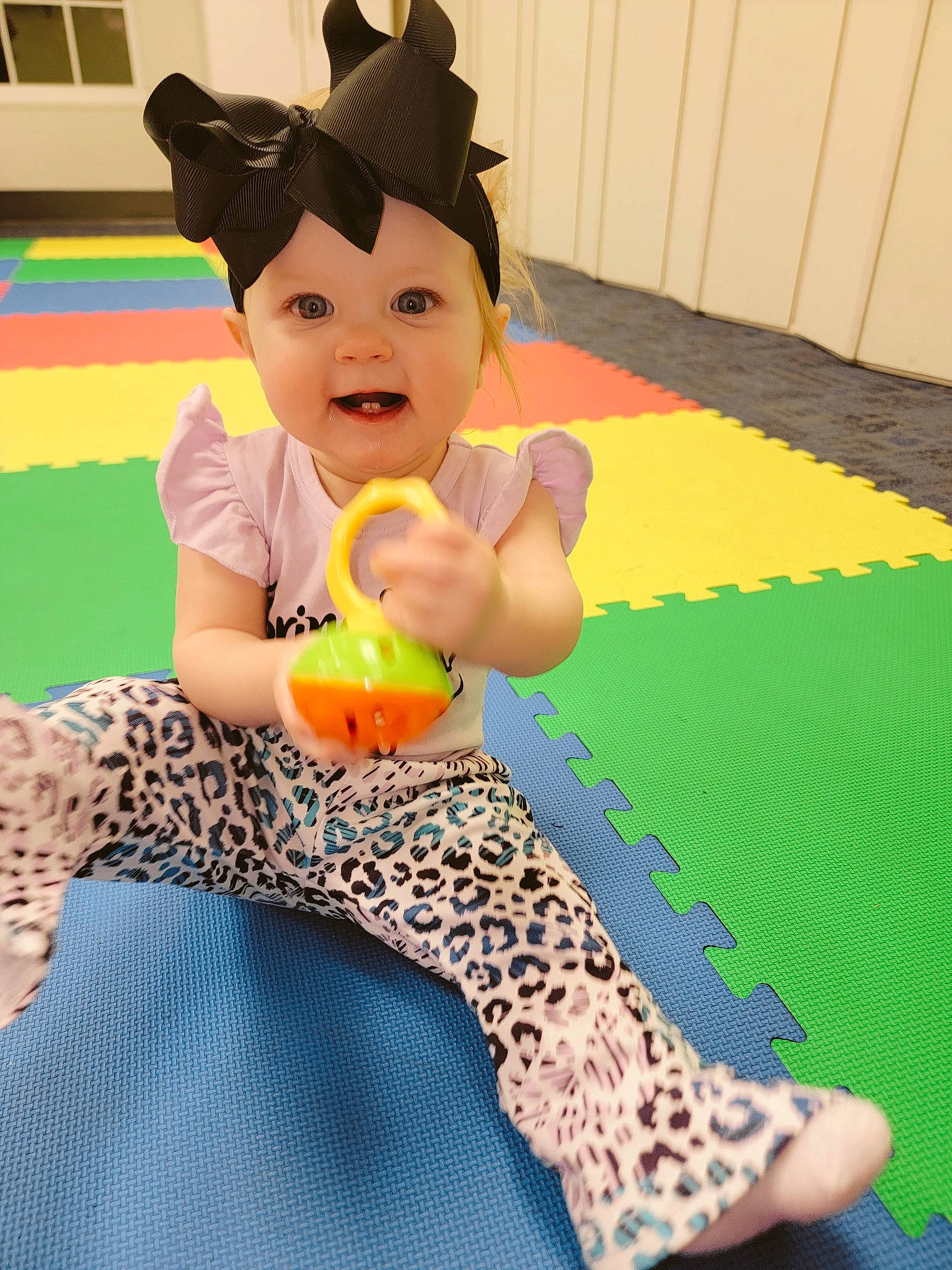 Alina joined the competition — help win amazing prizes! baby_playing_with_toys, baby_toddler_clothing, child, flooring, foot, fun, happy, headwear, human_leg, knee, leg, leisure, pattern, person, play, room, sitting, smile, thigh, toddler