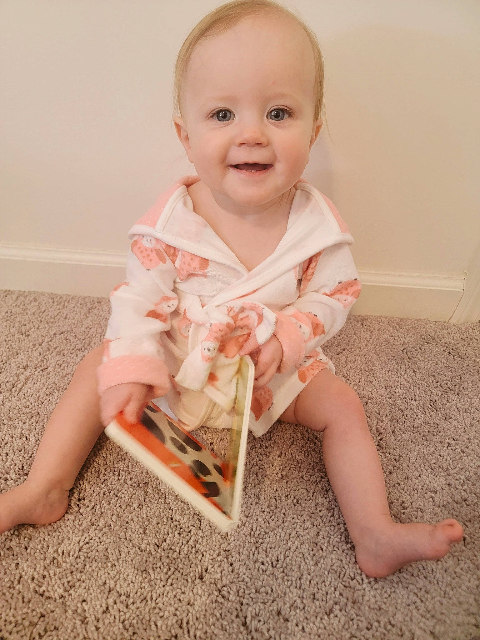 Alina is registered to the contest to win money with this photo: baby, baby_toddler_clothing, barefoot, cheek, child, collar, dress_shirt, eye, face, flooring, happy, head, human_leg, iris, joy, person, sitting, skin, sleeve, smile