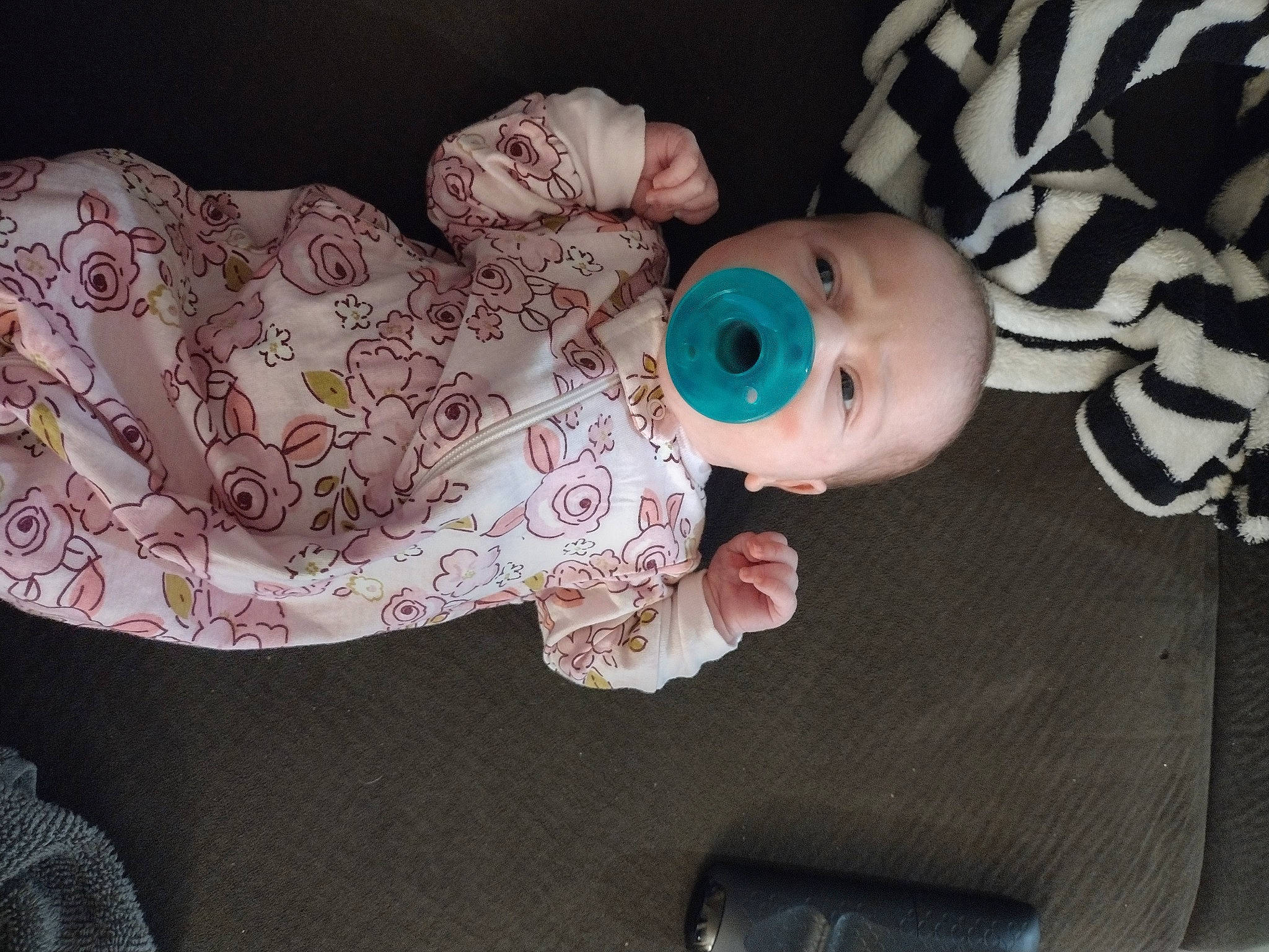 Aiyanna is registered to the contest to win money with this photo: baby, baby_products, baby_toddler_clothing, baby_toys, cheek, child, comfort, doll, human_body, linens, pattern, person, room, sitting, skin, sleeve, toddler, toy