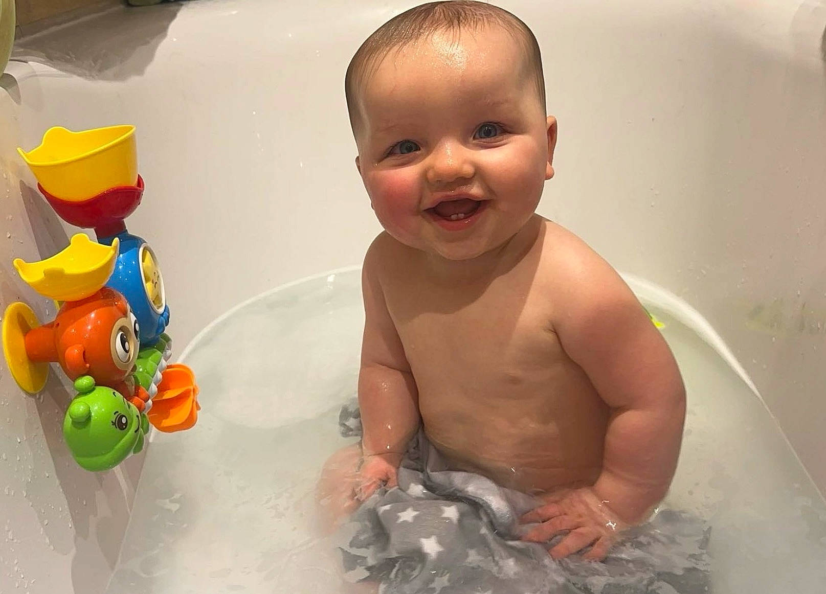 Milo joined the competition — help win amazing prizes! baby, baby_bathing, bath_toy, bathing, bathroom, bathtub, chest, child, facial_expression, fluid, fun, happy, joy, leisure, organ, person, plumbing, skin, smile, toddler