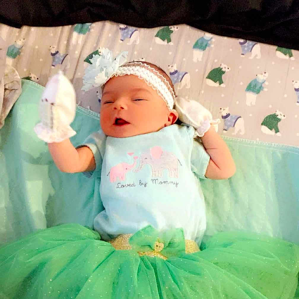 Katerina is registered to the contest to win money with this photo: accessories, baby, bed, bedroom, clothing, costume, crib, dress, face, furniture, hat, head, indoors, infantbed, jewelry, newborn, person, photography, portrait, room