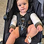 Lyzio participe au concours pour gagner de l'argent avec cette photo : toddler, stroller, bandage, iv_drip, medical_wristband, child, hospital, indoors, sitting, black_clothing, face, expression, medical_treatment, foot_bandage, seatbelt, person, young_child, floor, candid, healthcare