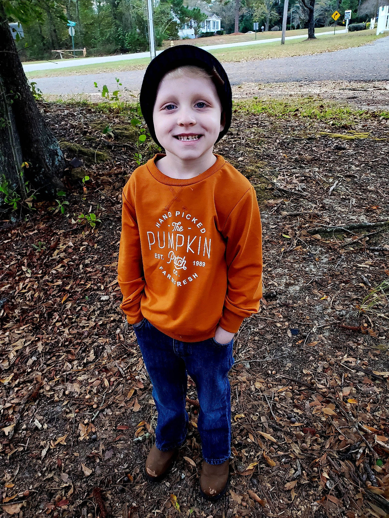 Easton is registered to the contest to win money with this photo: baby_toddler_clothing, child, eye, face, fun, grass, happy, hat, head, headwear, joy, leisure, pattern, people_in_nature, person, plant, recreation, sleeve, smile, soil