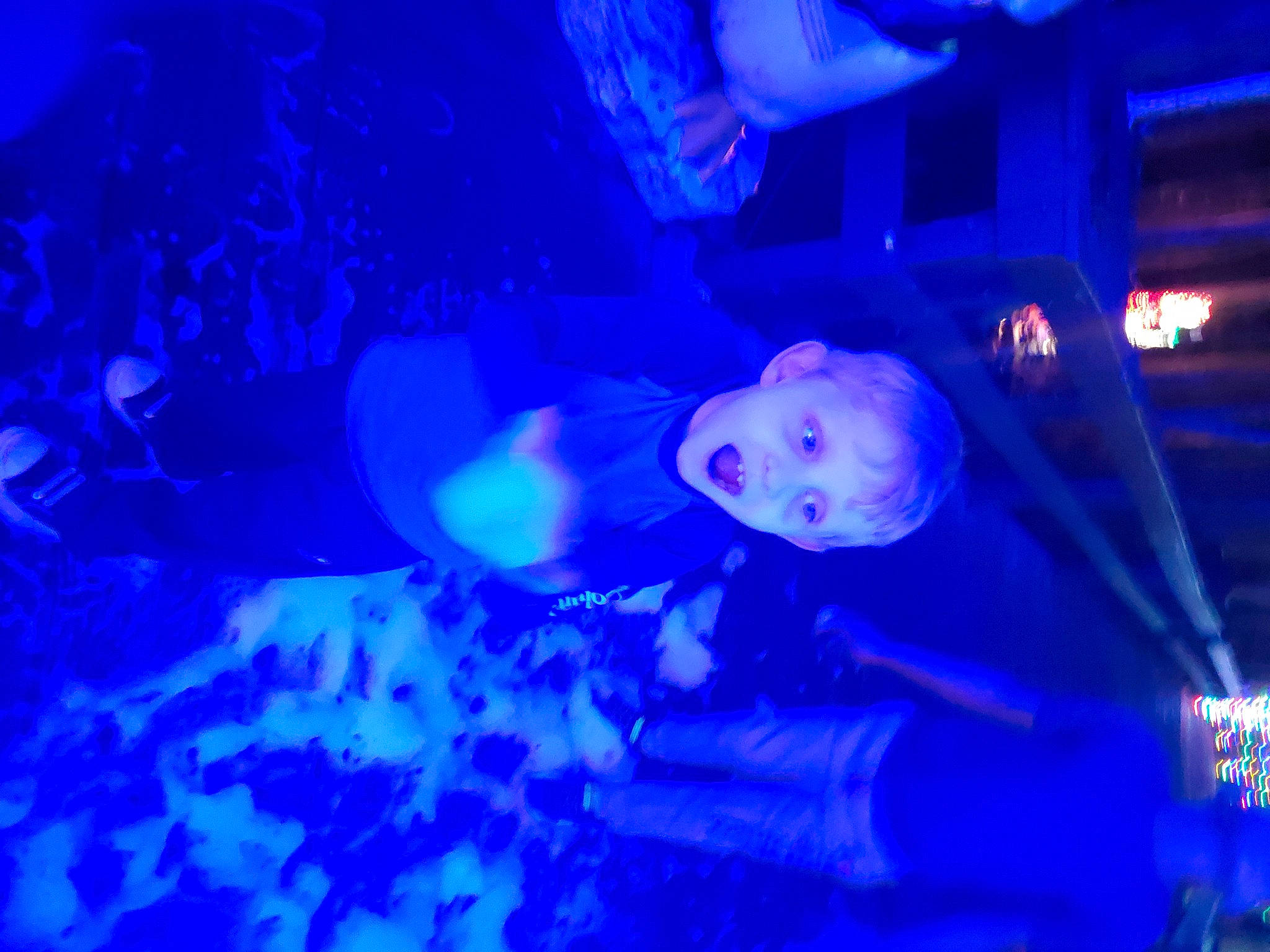 Easton is registered to the contest to win money with this photo: blue, concert, electric_blue, entertainment, event, fun, hat, magenta, marine_biology, music, music_artist, music_venue, musical_instrument, musician, performing_arts, person, purple, sky, violet, visual_effect_lighting