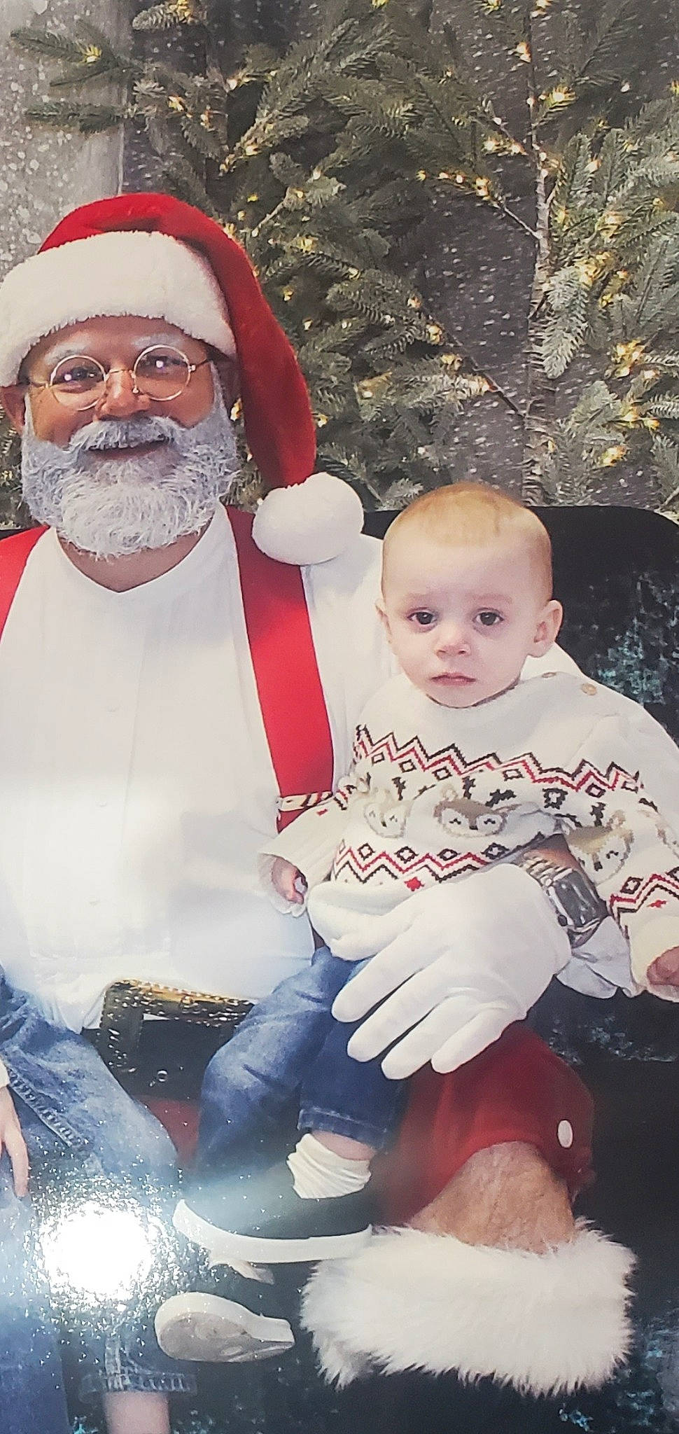 Micah is registered to the contest to win money with this photo: baby, baby_toddler_clothing, beard, child, event, face, facial_expression, facial_hair, fictional_character, fun, hairstyle, happy, headwear, holiday, lap, moustache, person, santa_claus, sitting, smile