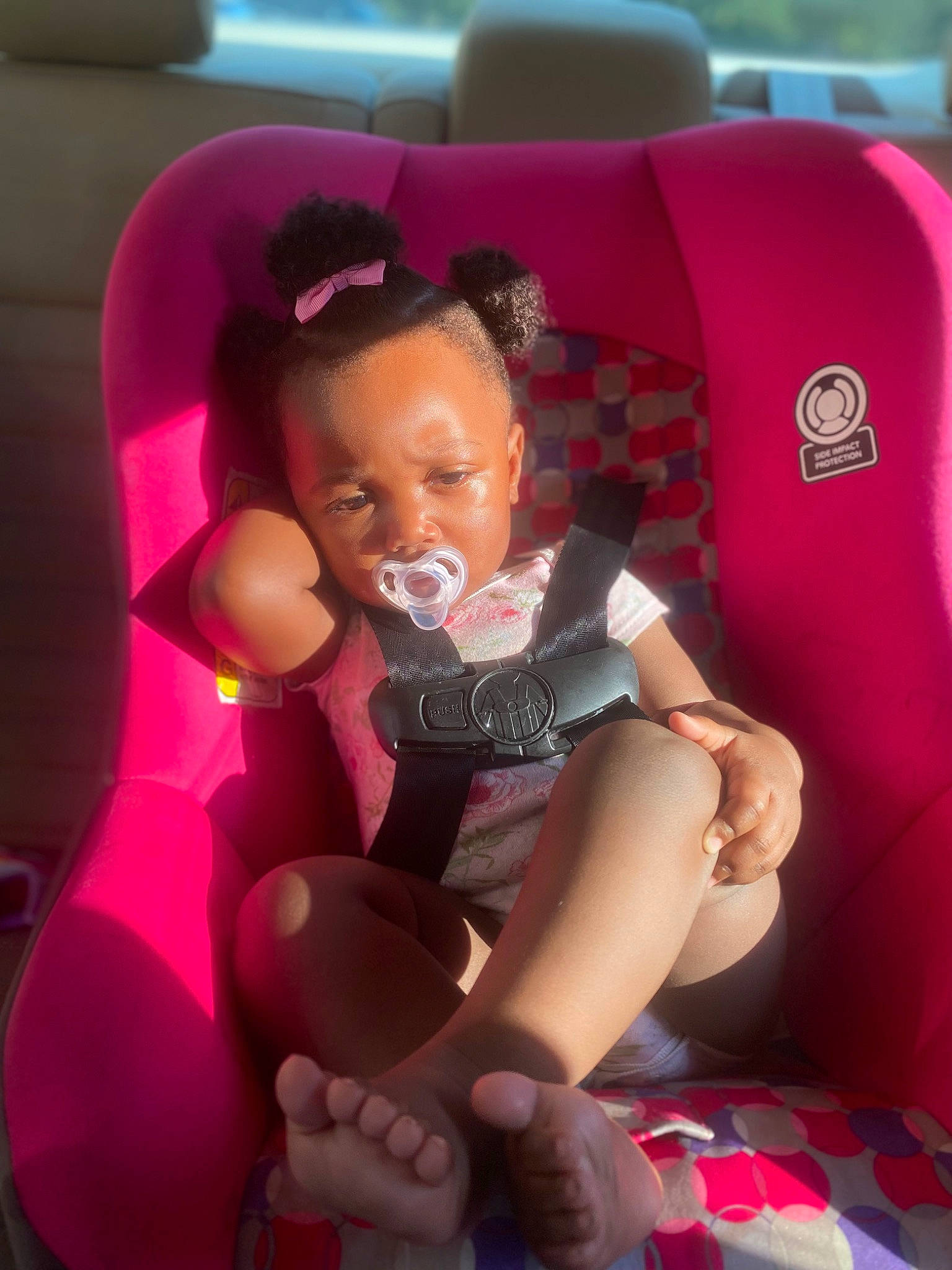 Amari joined the competition — help win amazing prizes! baby_toddler_clothing, car_seat, carmine, child, comfort, fun, hand, human_leg, lap, leg, leisure, magenta, person, pink, purple, shorts, sitting, smile, thigh, thumb