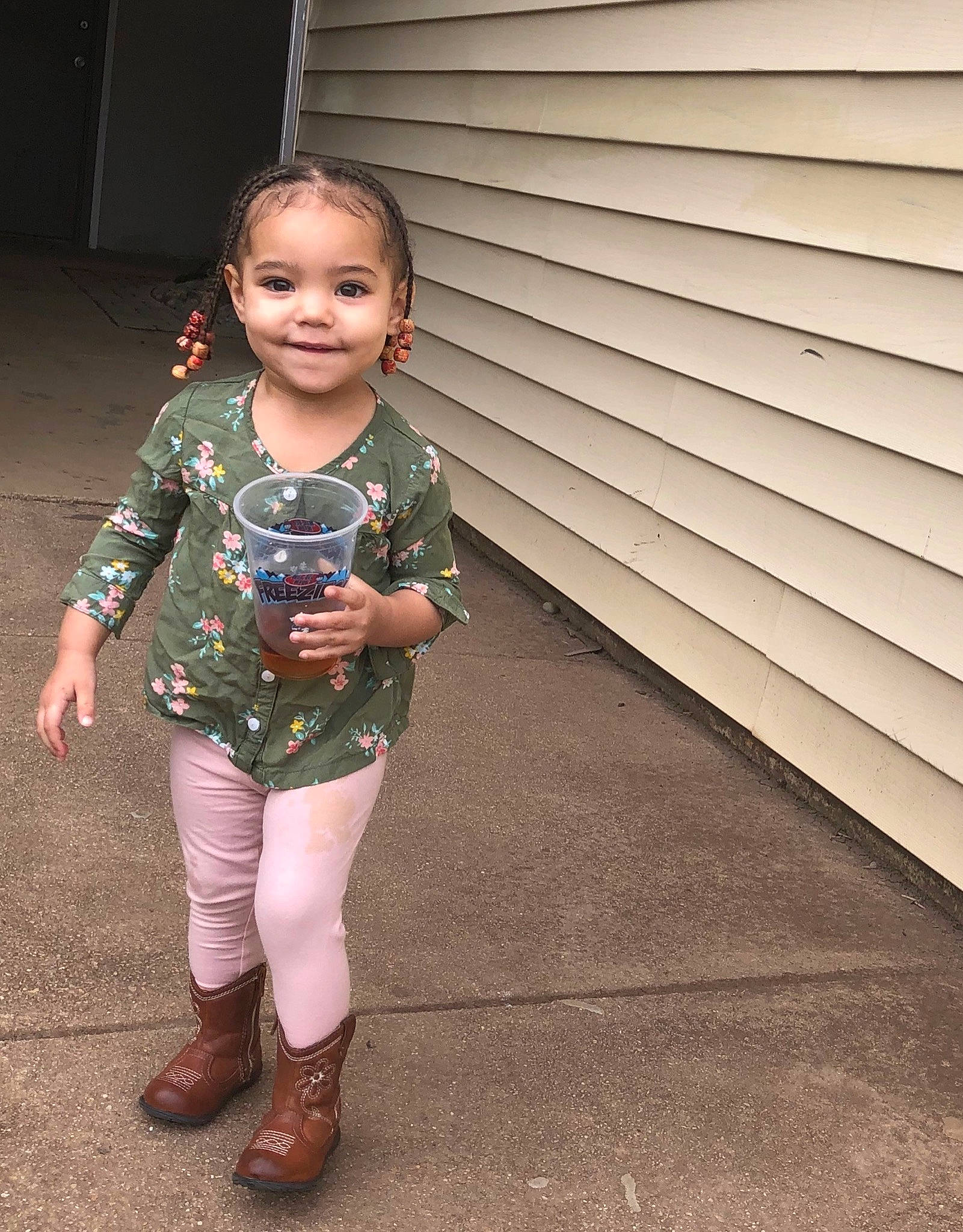 Lauryn is registered to the contest to win money with this photo: baby, boot, child, footwear, jacket, joint, joy, knee, leg, leggings, outerwear, pattern, person, shoe, skin, sleeve, smile, standing, tights, toddler