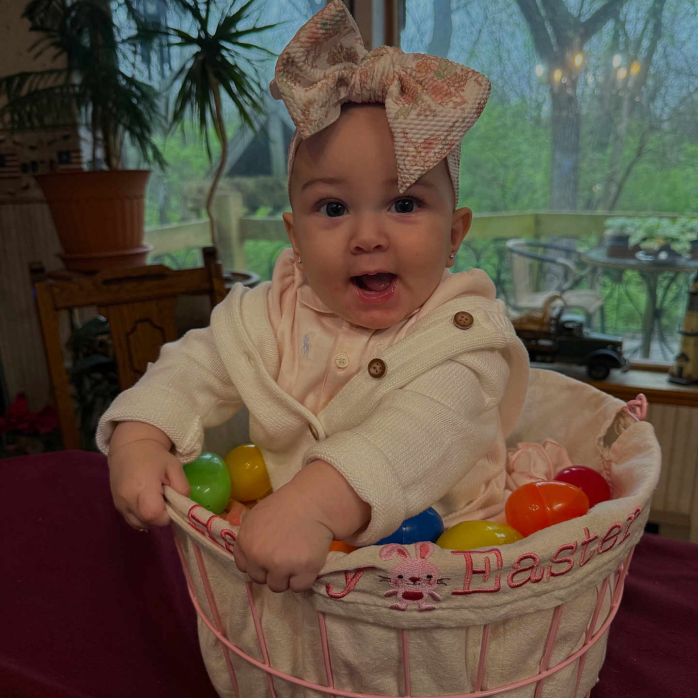Kylahna is registered to the contest to win money with this photo: baby, basket, bed, bonnet, candy, clothing, crib, desk, face, food, furniture, hat, head, infantbed, person, photography, plant, sweets, table, wood