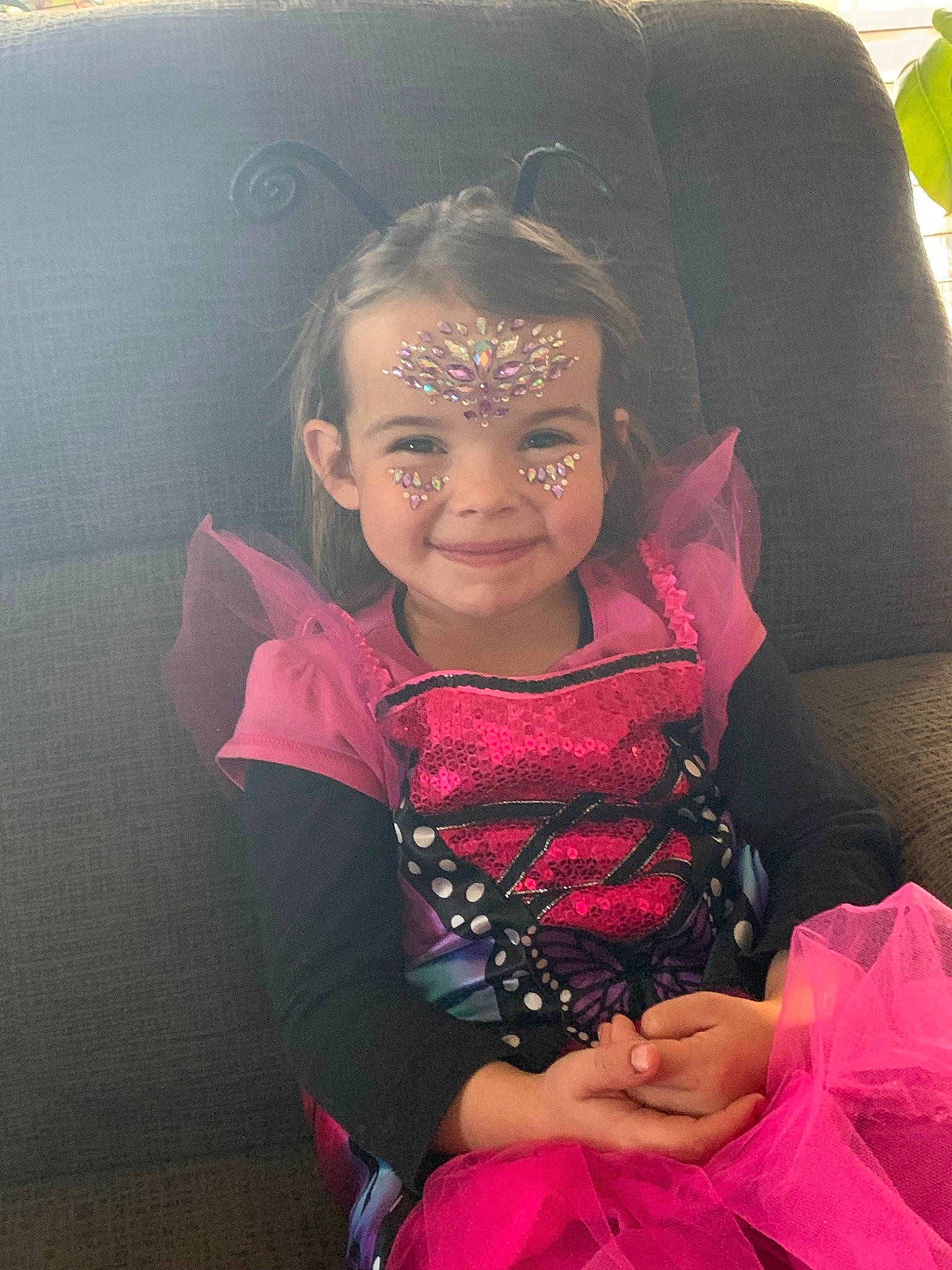 Ella Mae Lynn is registered to the contest to win money with this photo: baby_toddler_clothing, black_hair, cool, dress, embellishment, event, facial_expression, fashion_design, flash_photography, grass, happy, iris, jewellery, joy, lip, magenta, person, pink, sitting, skin