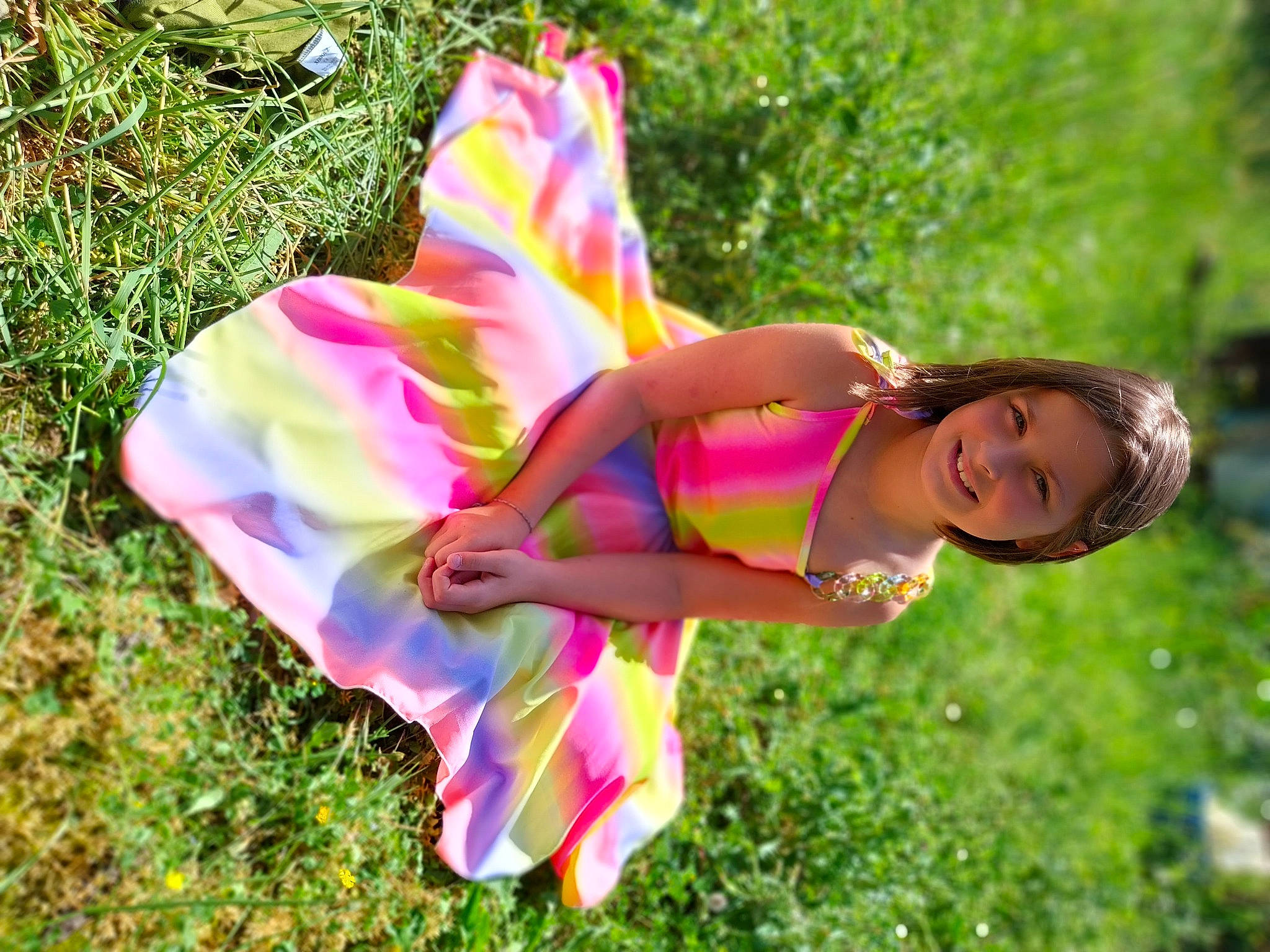 Alyssonne participe au concours pour gagner de l'argent avec cette photo : child, fashion_accessory, fun, grass, grassland, happy, human_leg, joy, leisure, magenta, people_in_nature, person, petal, pink, plant, recreation, smile, sunlight, swimwear, thigh