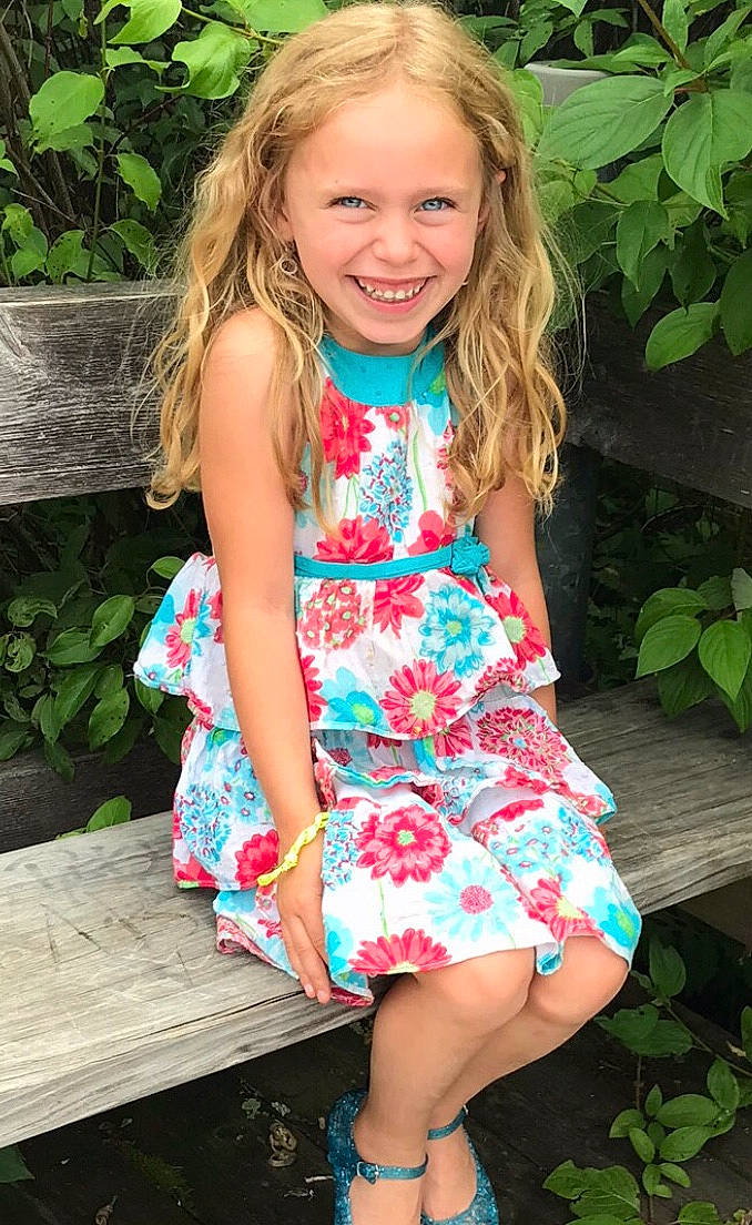 Ashlynn is registered to the contest to win money with this photo: baby_toddler_clothing, beauty, blond, calf, child, child_model, clothing, day_dress, dress, foot, human_leg, joy, one_piece_garment, pattern, person, pink, sandal, sitting, spring, summer