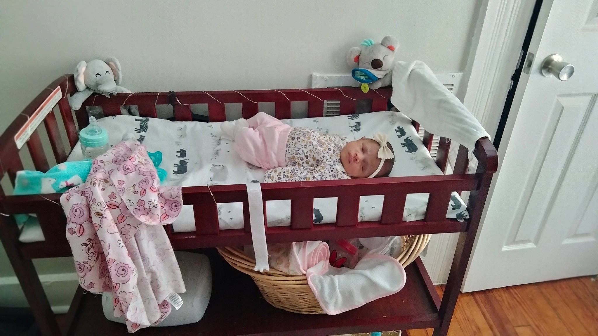 Iyla is registered to the contest to win money with this photo: baby_products, baby_safety, bedding, child, comfort, cradle, decoration, event, hardwood, headwear, infant_bed, interior_design, linens, magenta, nursery, pattern, person, pillow, room, textile