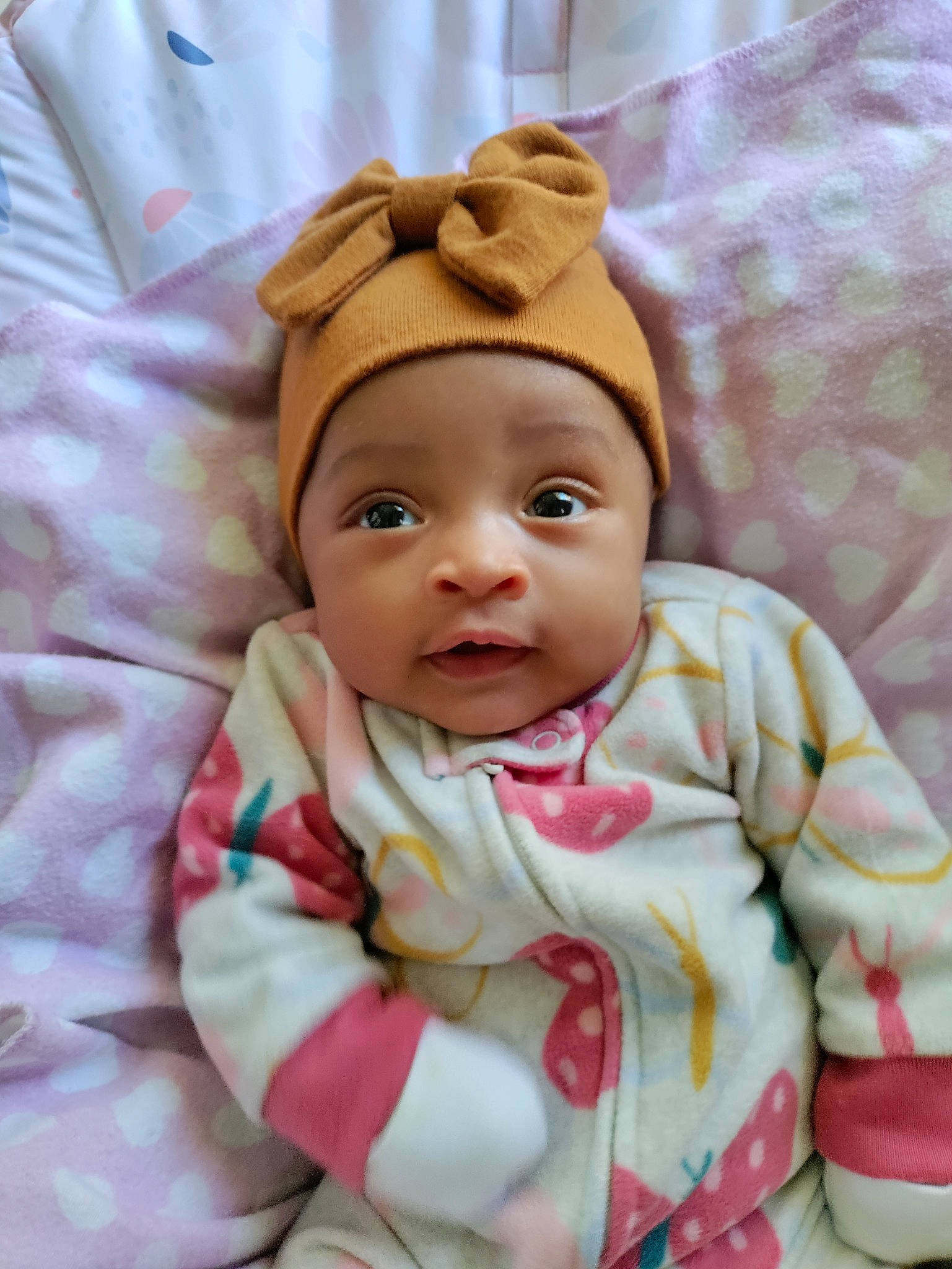 Iyla joined the competition — help win amazing prizes! baby, baby_products, baby_safety, baby_sleeping, baby_toddler_clothing, bedding, cheek, child, comfort, face, happy, headwear, linens, peach, person, pink, skin, sleeve, smile, textile