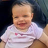 Royalynn is registered to the contest to win money with this photo: baby, smiling, happy, child, infant, pink_shirt, sweetheart, face, person, closeup, portrait, cute, young, skin, hair, sitting, holding, casual_clothing, expression, outdoor