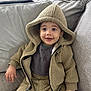 Angelo Hernandez is registered to the contest to win money with this photo: toddler, child, smiling, hooded_jacket, cozy_clothing, couch, gray_couch, indoor, happy, cute, baby, portrait, sitting, warm_clothes, fuzzy_texture, casual, home, infant, young_child, comfortable