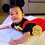 Angelo Hernandez joined the competition — help win amazing prizes! baby, infant, child, costume, mouse_ears, red_clothing, black_clothing, bow_tie, bracelet, blanket, cute, smile, face, lying_down, indoors, soft_texture, six_months, baby_milestone, portrait, playful