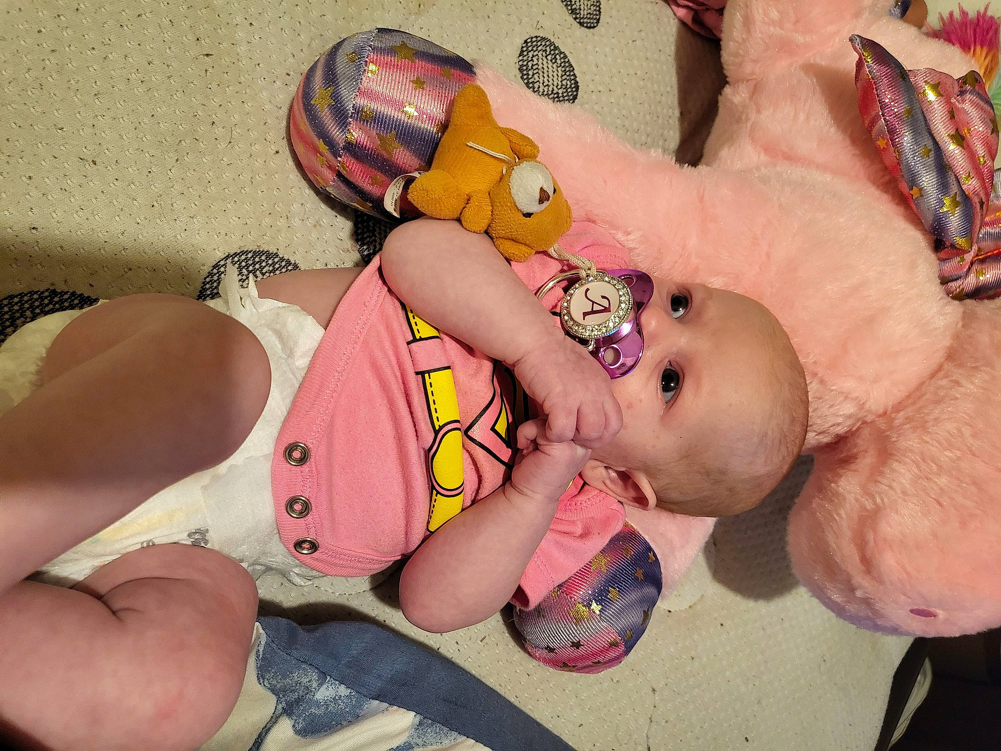Adalynn is registered to the contest to win money with this photo: abdomen, baby, baby_sleeping, baby_toddler_clothing, cheek, child, comfort, finger, foot, fun, happy, human_leg, mouth, nail, person, pink, skin, thigh, toddler, toy