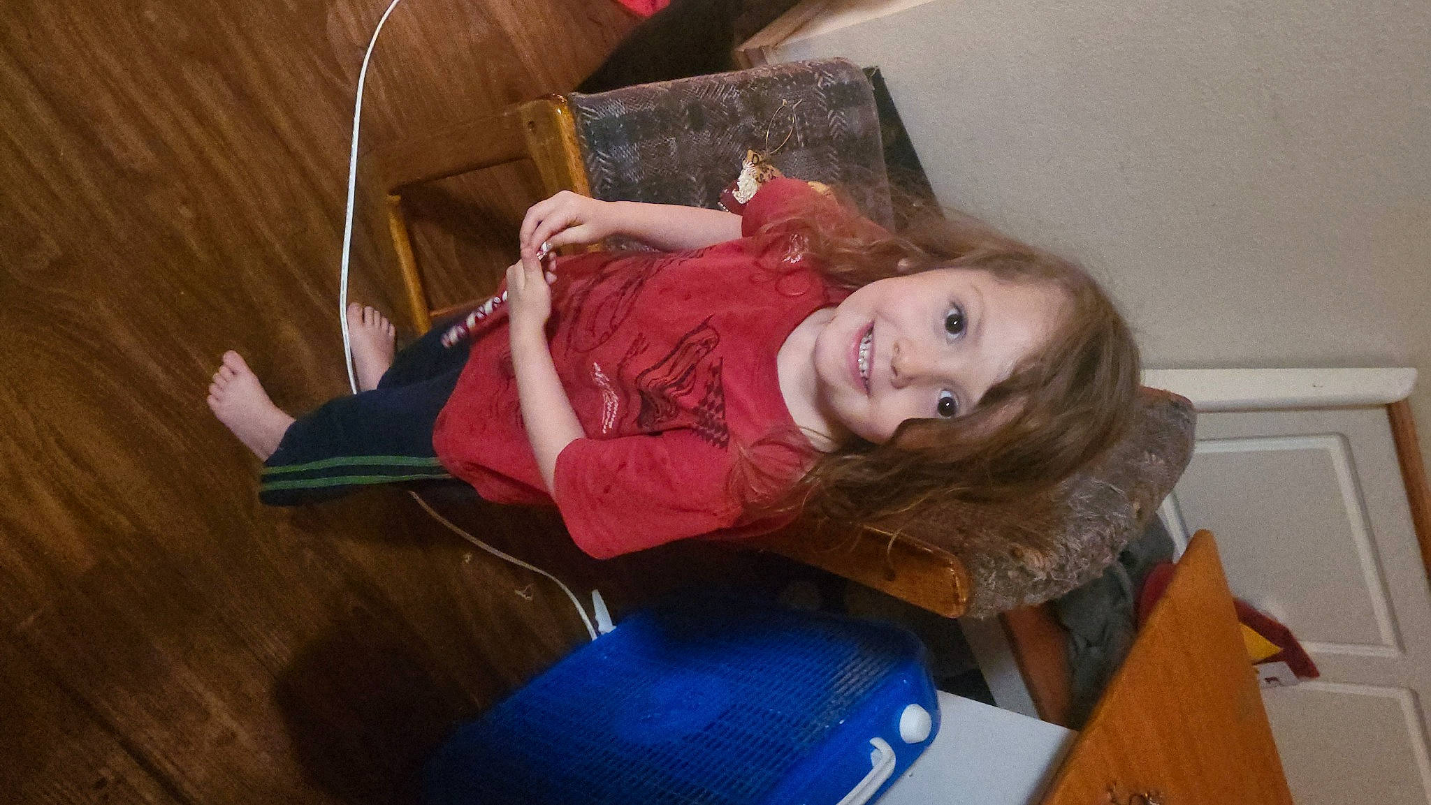 Serenity joined the competition — help win amazing prizes! chair, child, comfort, electric_blue, flooring, fun, fur, happy, hardwood, joy, leisure, long_hair, magenta, person, room, sitting, smile, toddler, wood