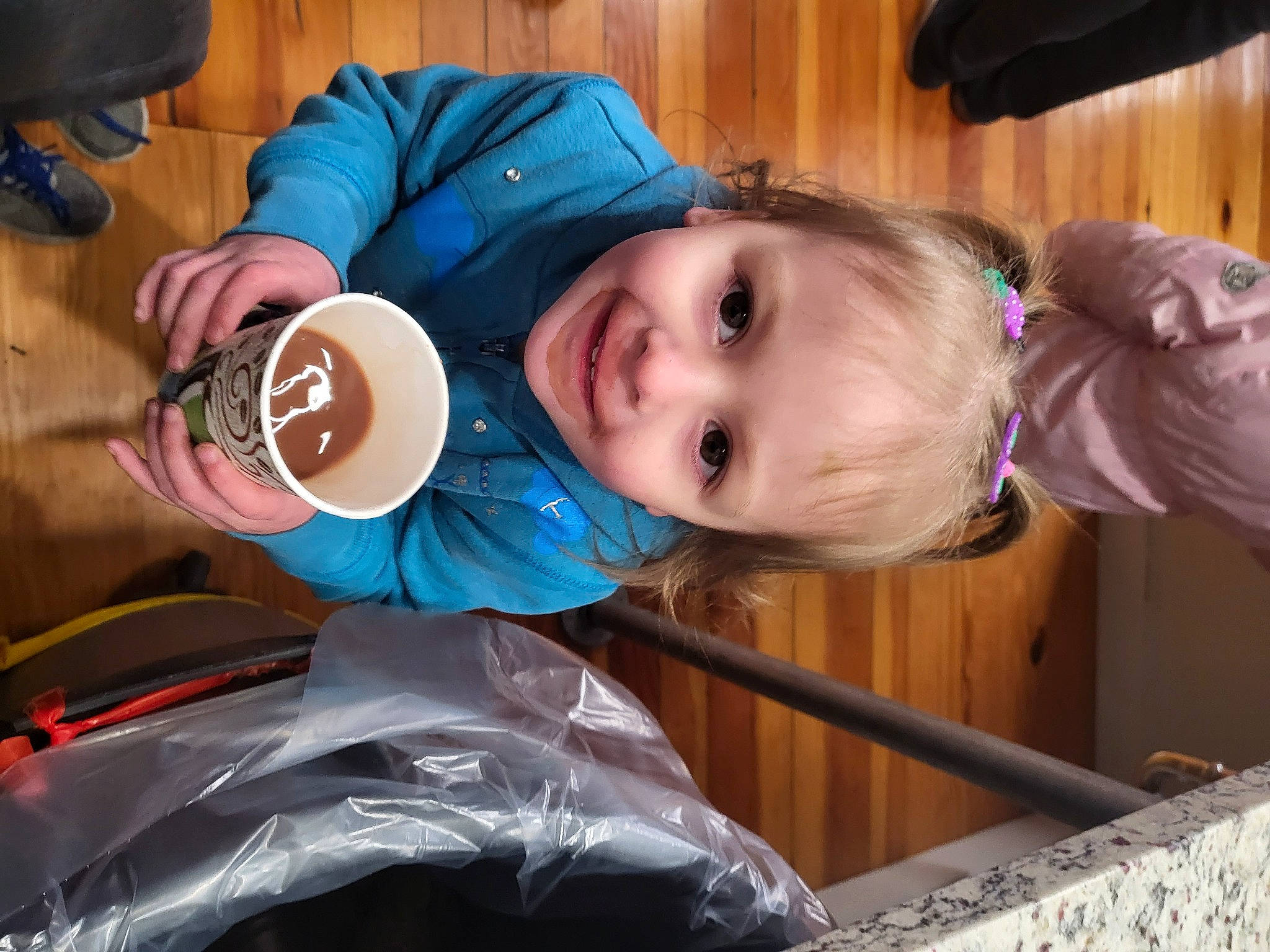 Kayleigh is registered to the contest to win money with this photo: baby_toddler_clothing, child, drink, drinking, electric_blue, food, fun, happy, hat, joy, mammal, person, product, smile, sun_hat, toddler, vacation, vertebrate, wood