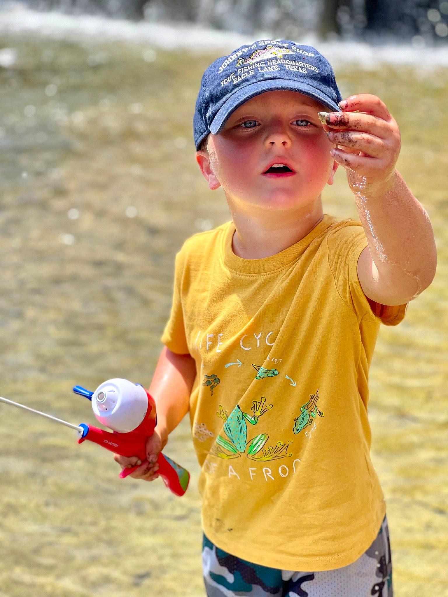 Landry joined the competition — help win amazing prizes! baseball_cap, cap, child, electric_blue, eyewear, finger, fun, gesture, goggles, happy, headwear, leisure, person, photograph, recreation, sand, sleeve, sunglasses, t_shirt, toddler