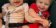 Paradise is registered to the contest to win money with this photo: baby, child, clothing, colorful, cute, fabric, face, hand, happy, infant, joy, mesh, outdoor, playful, seatbelt, sitting, smiling, stroller, toddler, young