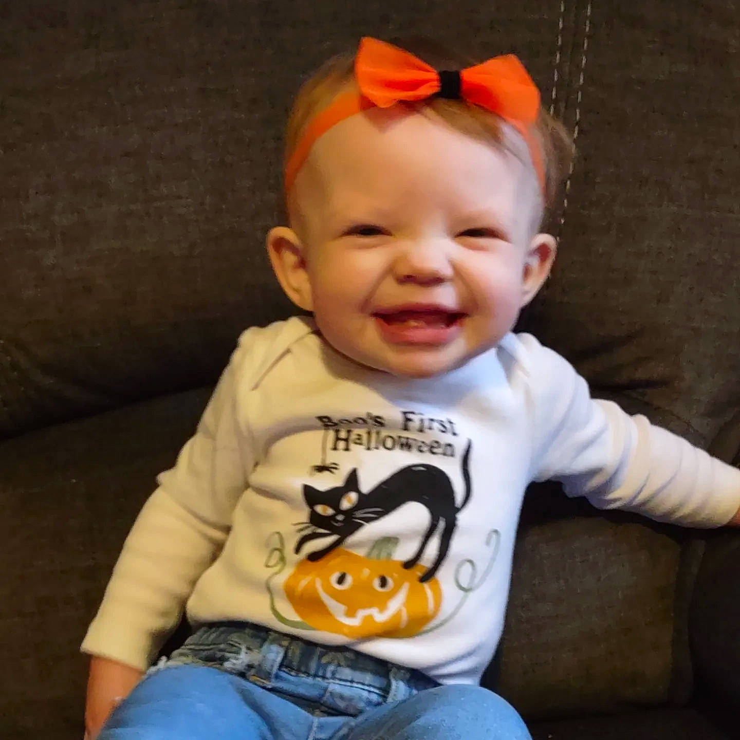 Ashlyn is registered to the contest to win money with this photo: baby_toddler_clothing, cheek, chin, clothing, eye, face, facial_expression, happy, head, human, human_body, jeans, joy, lip, mouth, nose, organ, person, product, skin