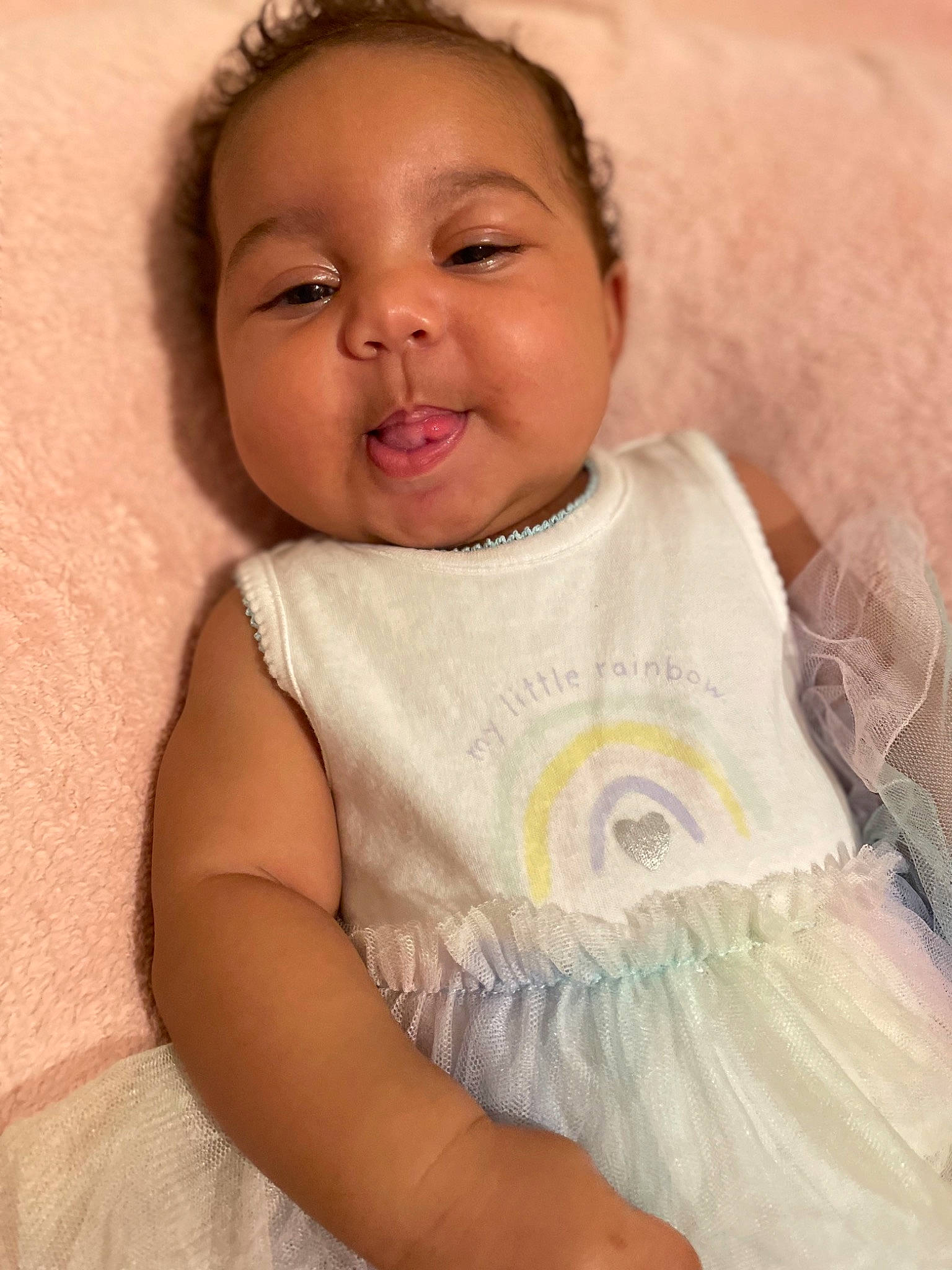 Charleigh joined the competition — help win amazing prizes! arm, baby, baby_toddler_clothing, cheek, child, comfort, eyelash, happy, linens, lip, nose, pattern, person, pink, portrait_photography, sitting, skin, sleeve, smile, textile