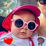 accessory, adult, baby, car_interior, casual, child, closeup, cute, fashion, heart_emoji, partial_face, pink_hat, portrait, reflection, seat, summer_clothing, sun_hat, sunglasses, trees, window