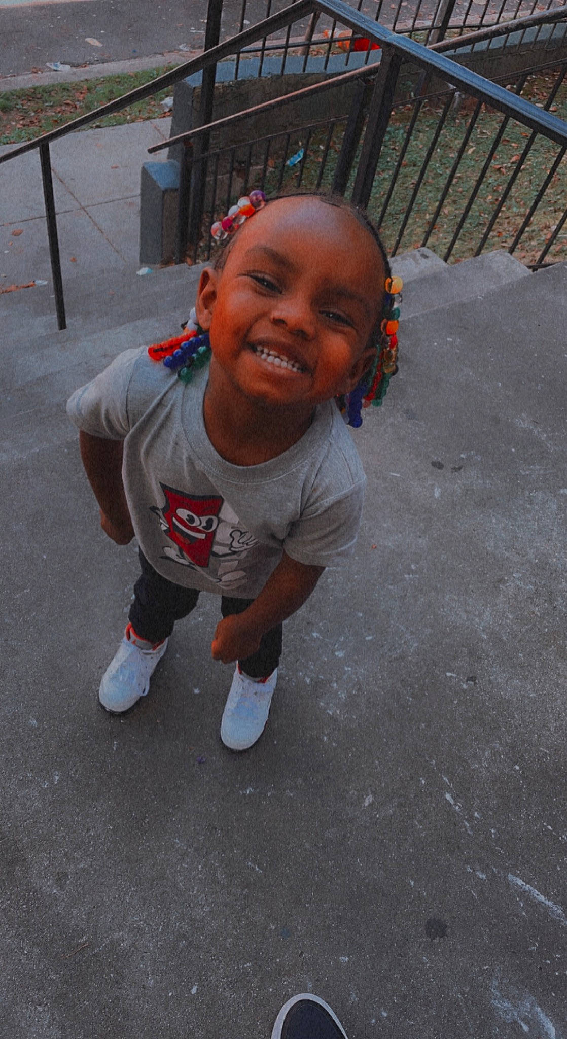 Amyra is registered to the contest to win money with this photo: asphalt, baby, baby_toddler_clothing, bench, child, concrete, eye, floor, flooring, fun, grass, happy, joy, person, recreation, road_surface, shorts, sidewalk, sitting, smile