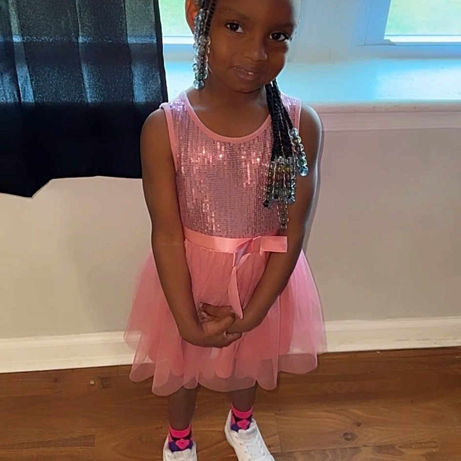 Amyra joined the competition — help win amazing prizes! baby_toddler_clothing, day_dress, dress, embellishment, fashion_design, floor, flooring, foot, fun, happy, hardwood, human_leg, knee, magenta, sleeve, sock, thigh, toddler, wood, wood_flooring