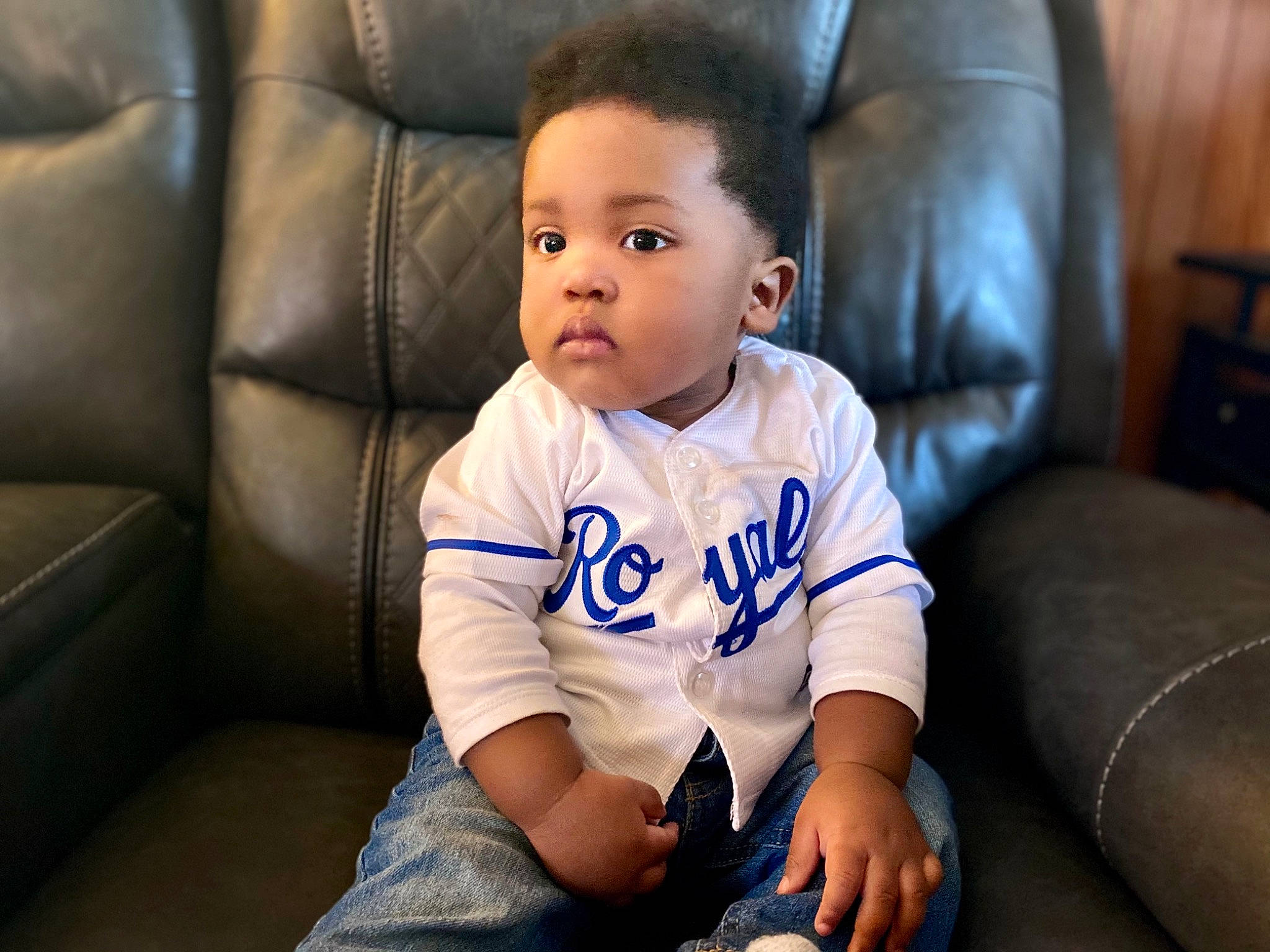 Coby joined the competition — help win amazing prizes! baby, baby_toddler_clothing, cheek, comfort, couch, elbow, eye, face, flash_photography, flooring, furniture, hair, happy, head, iris, knee, person, skin, sleeve, smile