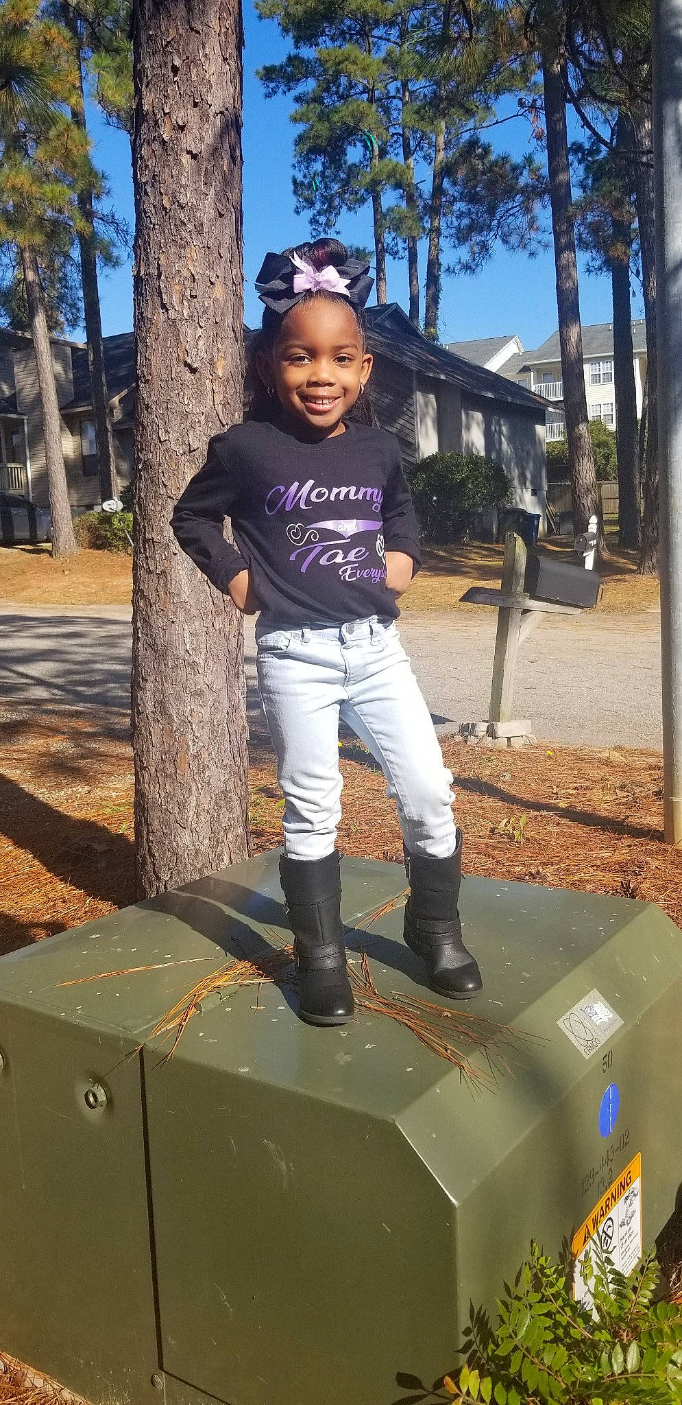 Taelynn is registered to the contest to win money with this photo: child, day, fun, girl, grass, jeans, joy, person, plant, play, public_space, recreation, tree, vacation