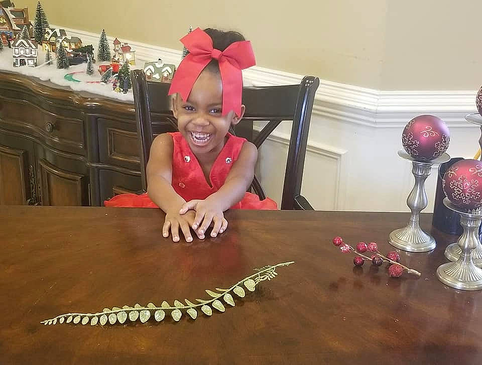 Taelynn is registered to the contest to win money with this photo: day, floor, flooring, fun, girl, joy, person, pink, play, table