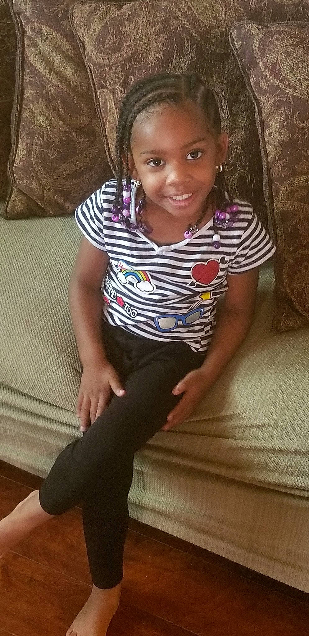 Taelynn is registered to the contest to win money with this photo: abdomen, arm, beauty, child, child_model, day, eye, fun, girl, hand, joy, leg, pattern, person, plaid, shoulder, sitting, smile, standing, thigh