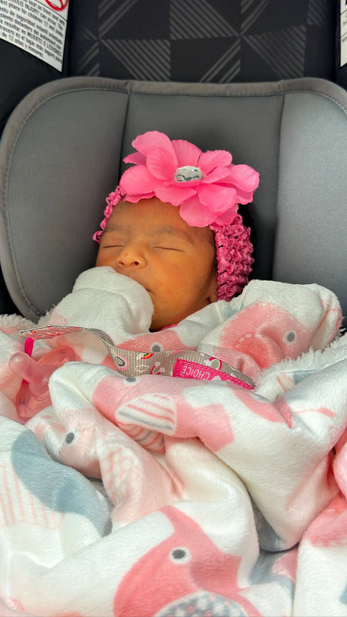 Alana is registered to the contest to win money with this photo: baby, baby_carriage, baby_products, baby_safety, baby_sleeping, baby_toddler_clothing, cheek, child, comfort, eyelash, face, flower, head, headwear, infant_bed, linens, nail, person, pink, product