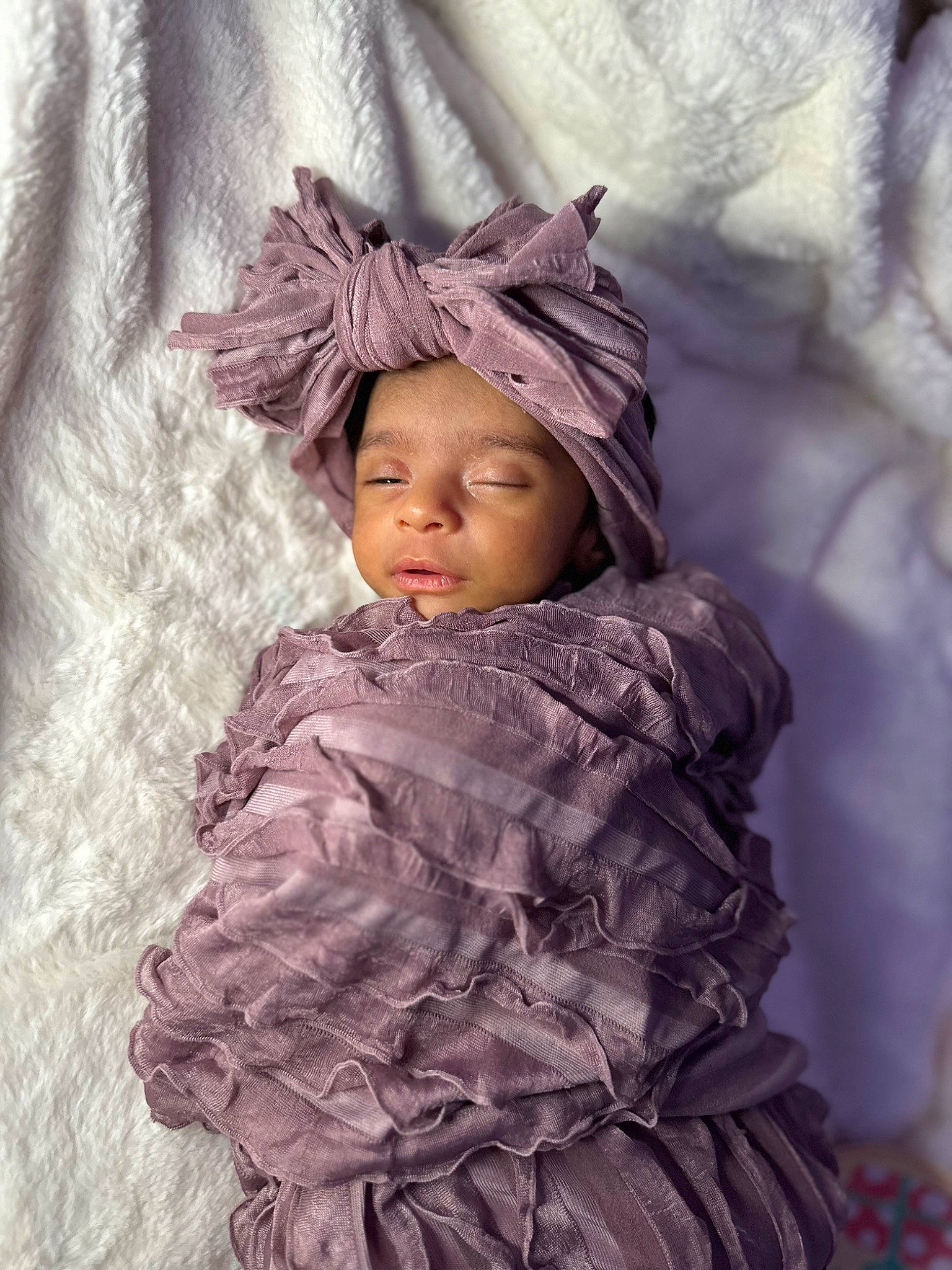 Alana joined the competition — help win amazing prizes! baby, baby_toddler_clothing, dress, eye, face, fur, happy, head, headpiece, headwear, iris, linens, magenta, outerwear, person, petal, pink, purple, sleeve, textile