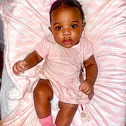 Essence joined the competition — help win amazing prizes! baby, child, pink_clothing, pink_socks, blanket, bows, pacifier, infant, cute, sitting, indoor, portrait, soft_texture, young_child, face, looking_at_camera, adorable, closeup, baby_girl, comfortable