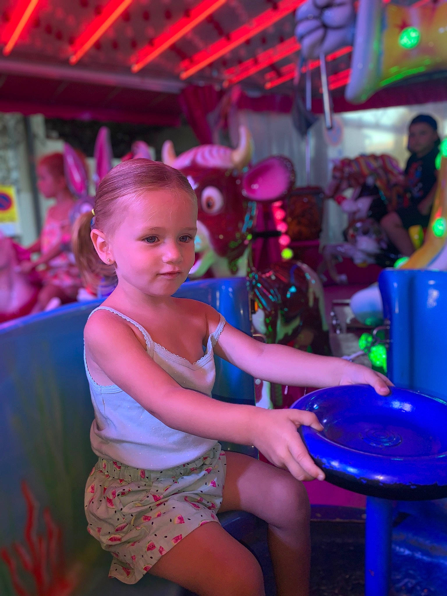 Beverley participe au concours pour gagner de l'argent avec cette photo : blue, child, entertainment, event, fun, hat, human_leg, leisure, magenta, performance, performing_arts, person, pink, purple, recreation, sandal, sitting, table, thigh, toddler
