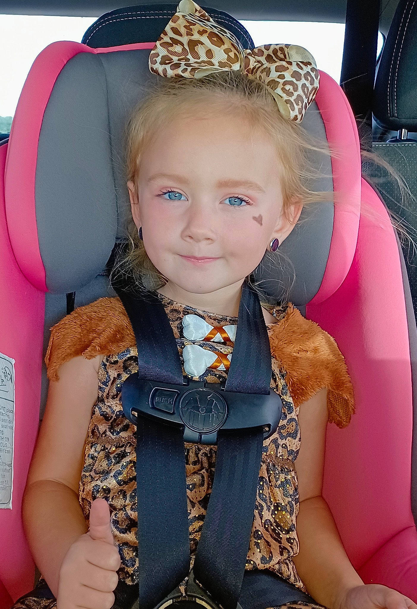 Kennedy is registered to the contest to win money with this photo: baby_toddler_clothing, black, child, cool, costume_hat, dress, eye, face, facial_expression, fashion, hairstyle, happy, headgear, headpiece, organ, person, pink, product, skin, sleeve