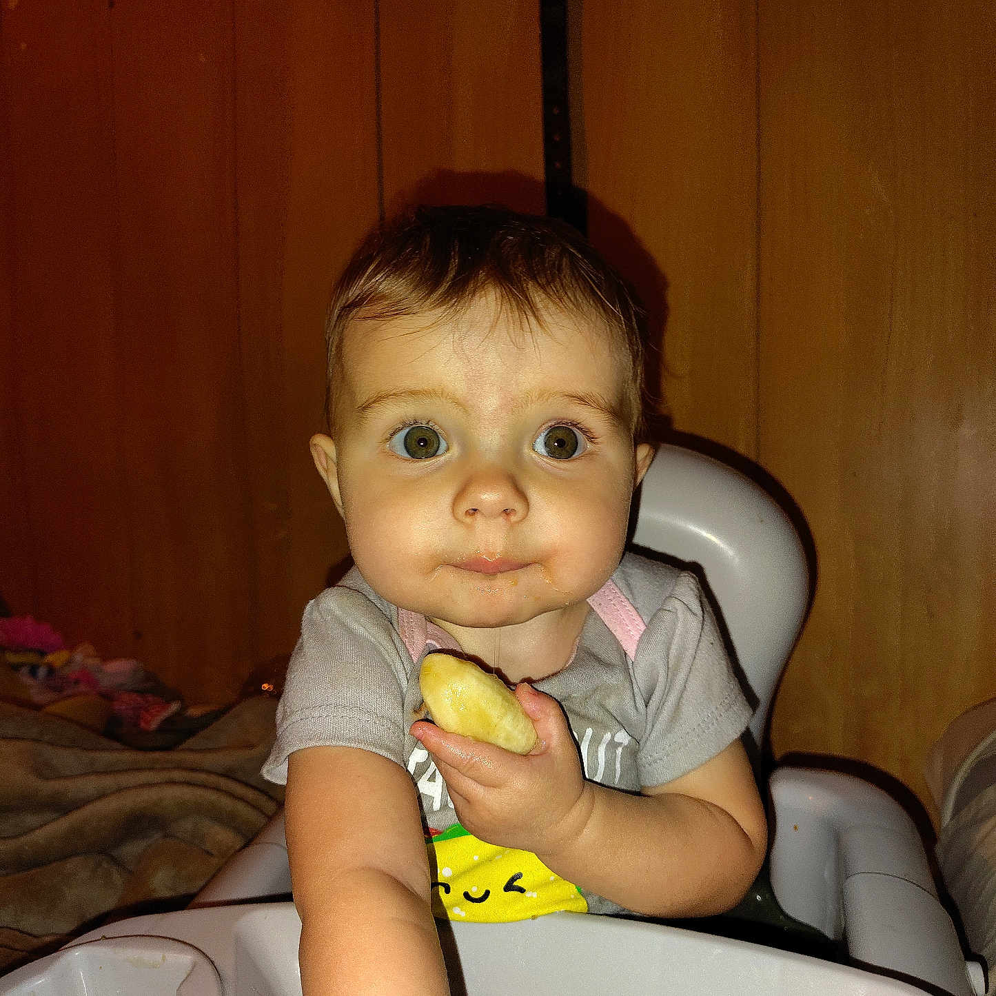 Vallarie is registered to the contest to win money with this photo: baby, banana, bodypart, bread, couch, cutlery, eating, face, finger, food, fruit, hand, head, person, photography, plant, portrait, produce, sink, spoon