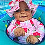 Makiyah joined the competition — help win amazing prizes! baby, child, pool, water, float, hat, sunhat, swimsuit, strawberry, pink, blue, smile, happy, outdoor, summer, cute, infant, floating, hands, face