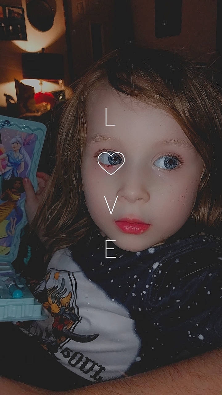 Brittany is registered to the contest to win money with this photo: bangs, black_hair, blond, brown, brown_hair, cheek, chin, cool, doll, eyebrow, eyelash, flash_photography, forehead, fun, iris, lip, long_hair, nose, person, toy