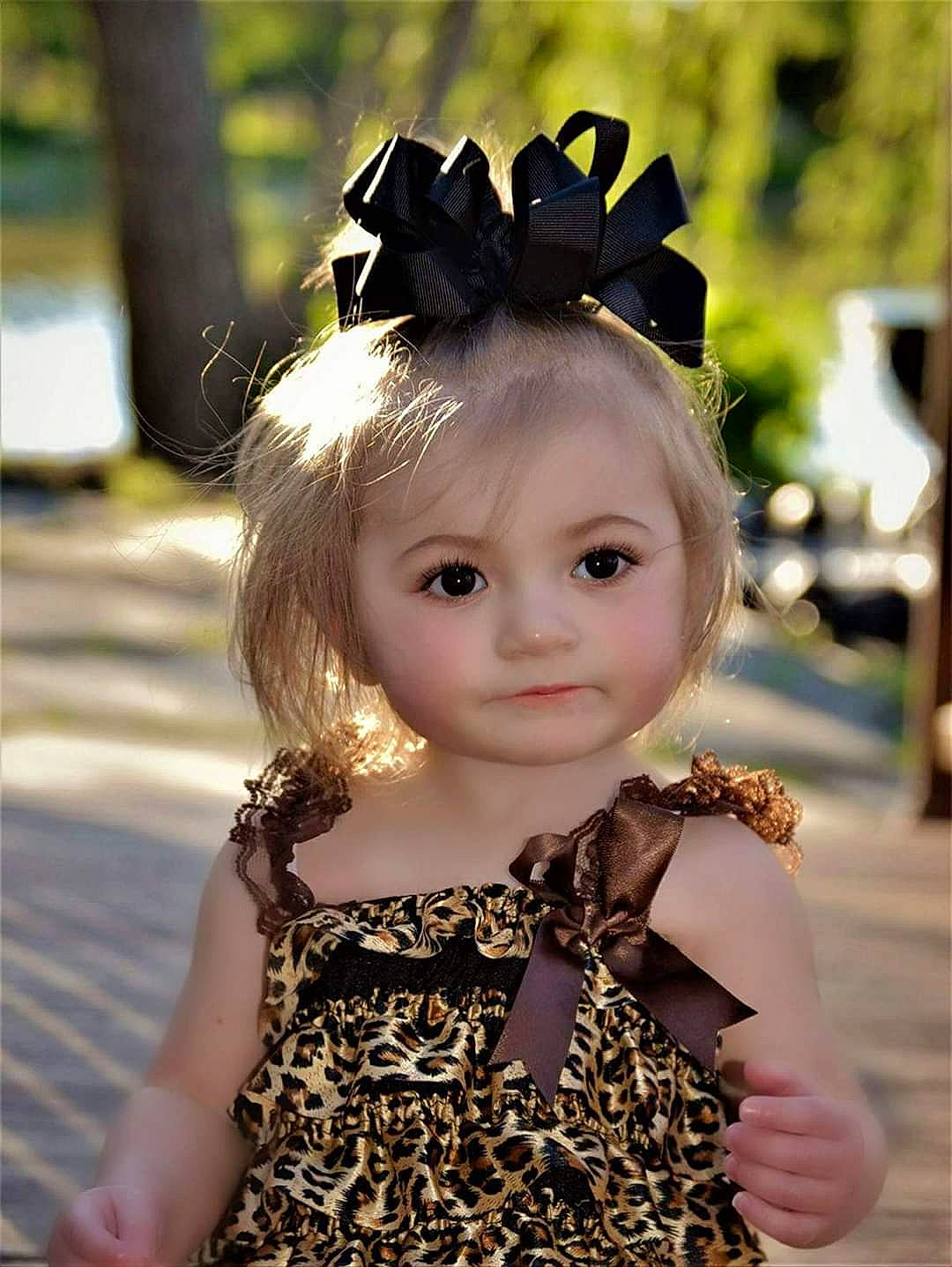 Kaydence is registered to the contest to win money with this photo: brown_hair, cheek, child, doll, dress, ear, face, fashion_accessory, fawn, hair, hair_accessory, hairstyle, head, headband, headgear, headpiece, person, toddler, toy