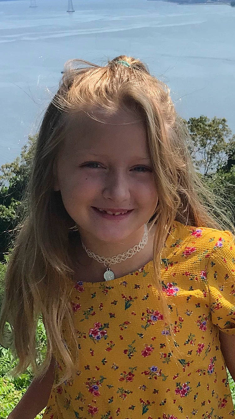 Sara is registered to the contest to win money with this photo: botany, child, chin, cool, eyebrow, fawn, fun, grass, hair, happy, human, iris, joy, lip, mammal, neck, people_in_nature, person, skin, sleeve